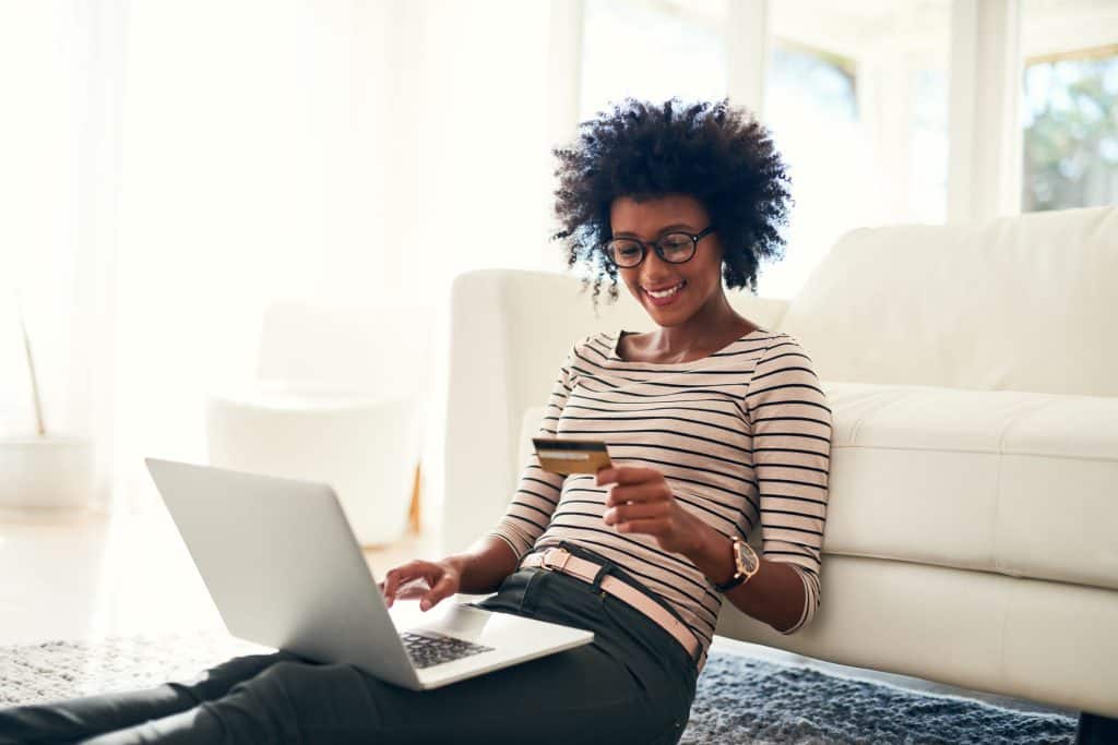 woman with credit card making an online purchase