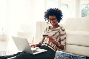 woman with credit card making an online purchase