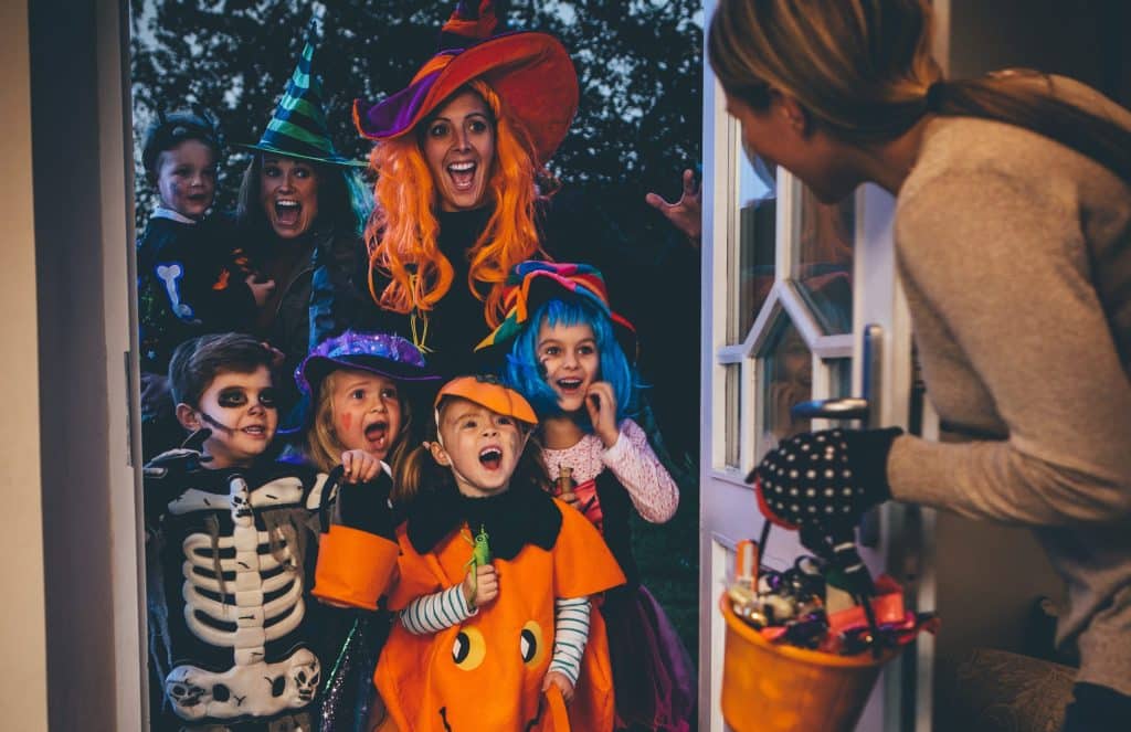kids dressed up for halloween trick-or-treating