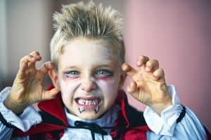 boy dressed up as a vampire for halloween