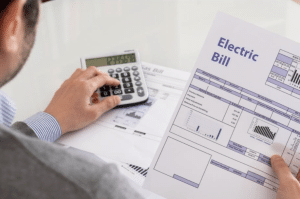 person calculating energy bill