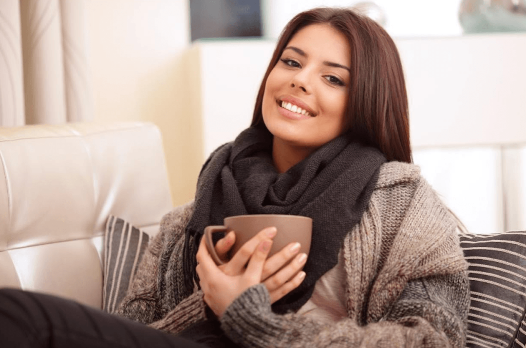 A San Diego Homeowner staying warm inside her whole-home central heated Southern California home this winter.